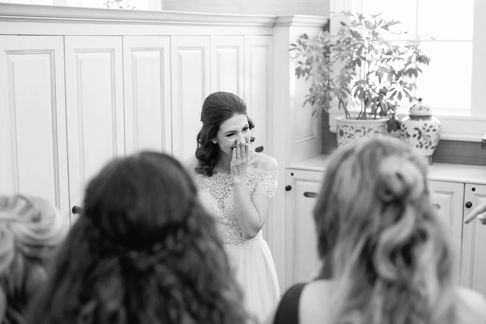 bride crying with bridesmaids