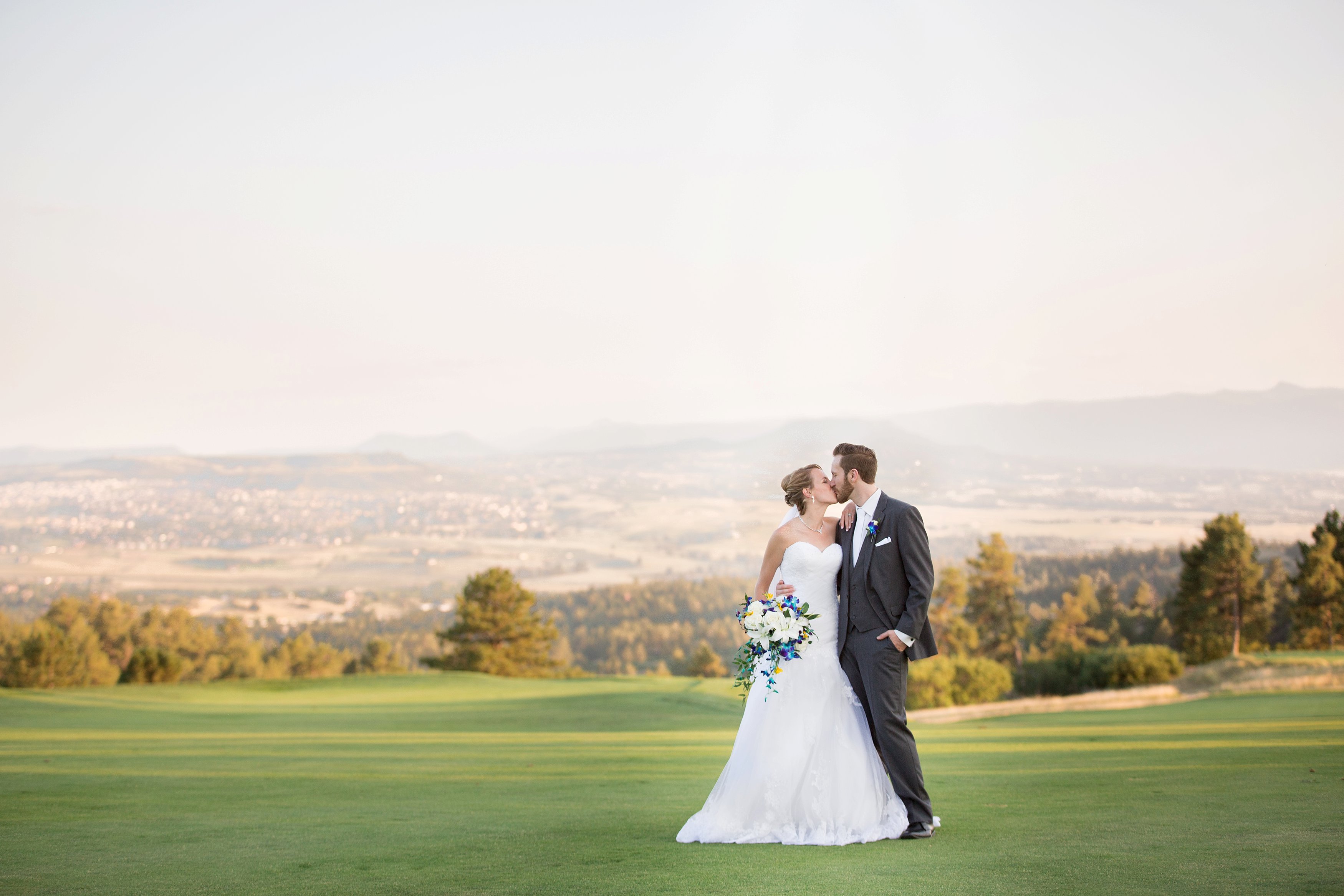 bride & groom at sanctuary golf course colorado wedding